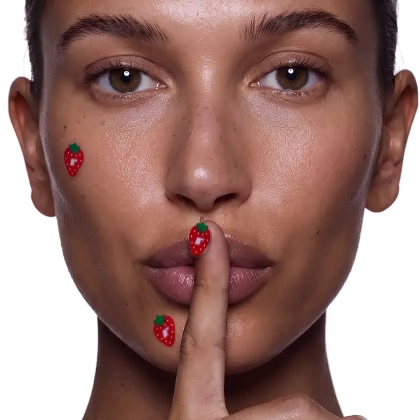 A beauty model with a finger to her lips, a campaign image made with AI.