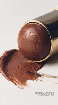 A bronze balm swiped on a clean surface, the bullet and case kept true