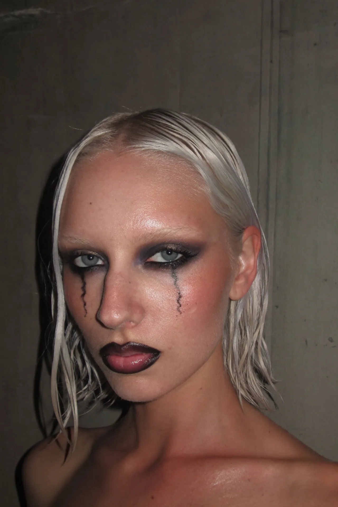 AI beauty image with runny liner and raw, real-looking skin