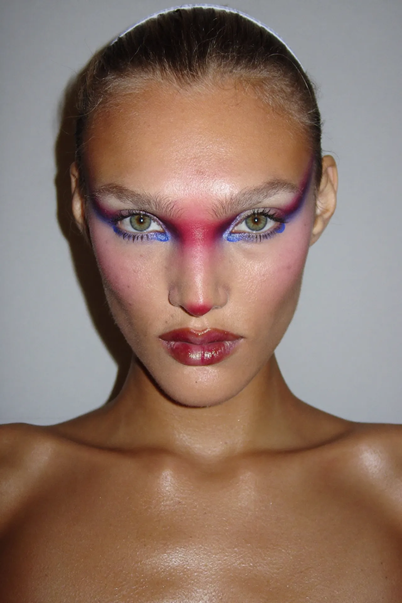 An AI beauty portrait keeping real skin texture: pores, shine and peach fuzz.